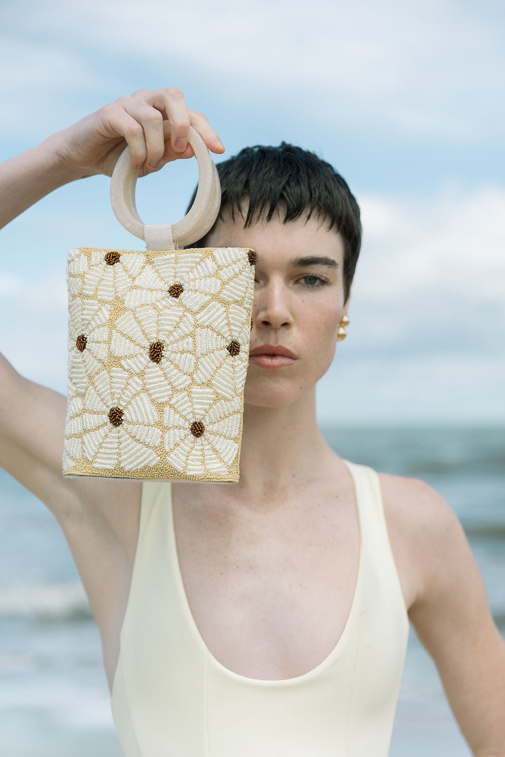 Still Bloom beaded bag in hand, detail of shape and beadwork