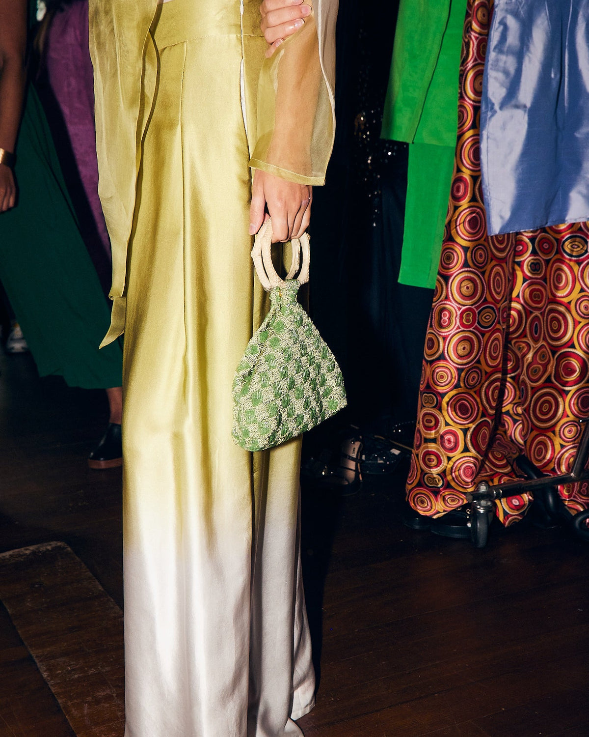 Intimate Exchange sage beaded bag lifestyle shot for elegant events and weddings