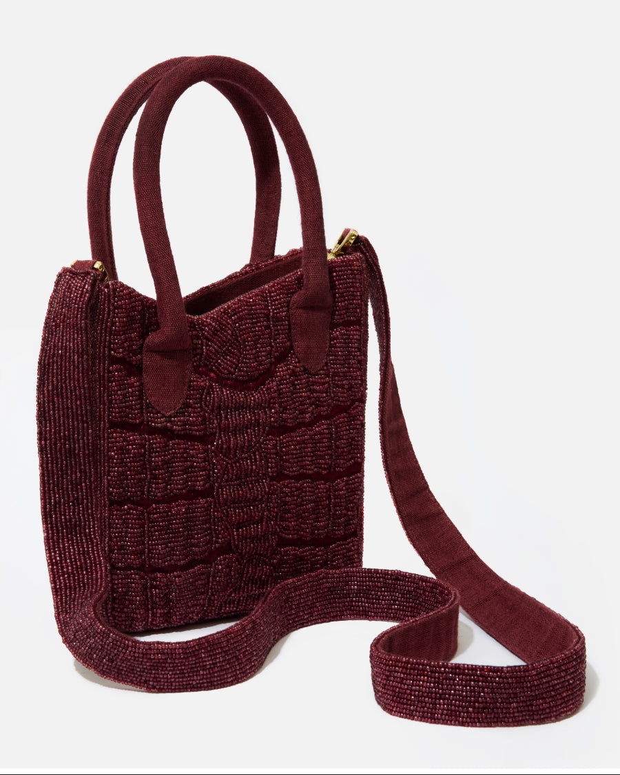 Artisan-made Wonder Before Why handbag in burgundy, featuring a trendy beaded texture and structured silhouette.