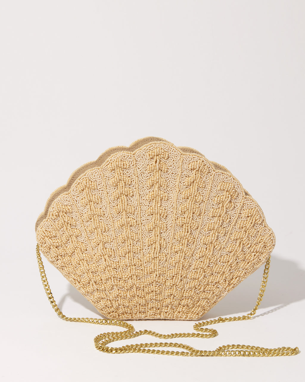 Front view of the Stand Still beaded clutch with its detachable gold chain strap, showcasing its transition from clutch to crossbody bag.