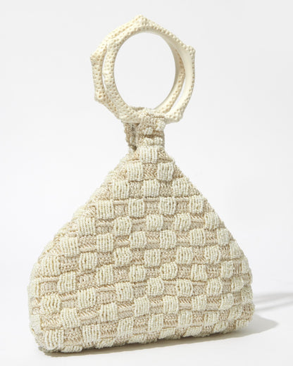 Intimate Exchange ivory beaded handbag, designer statement bag, angled view