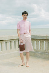 Model holding The Wonder Before Why beaded bag full body shot everyday bag