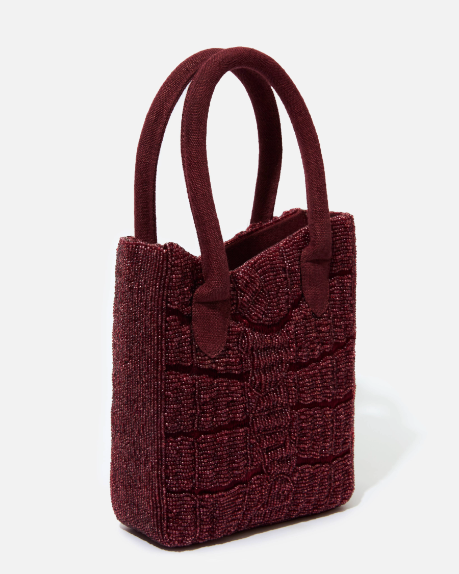 Wonder Before Why hand-beaded burgundy snake skin pattern bag side profile view