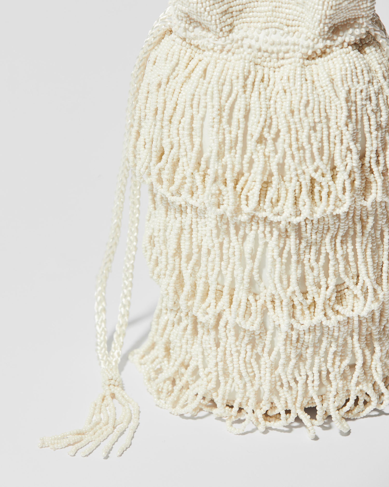 drawstring tassel detail fringe crossbody bag with three layered tassel tiers, gathered drawstring top