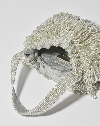 internal view of Mira Silver beaded Tassel bag with layered fringe top strap by the hold 