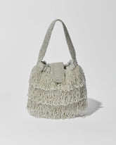 Silver beaded Tassel bag with layered fringe, top strap and beaded flap closure. Front view.