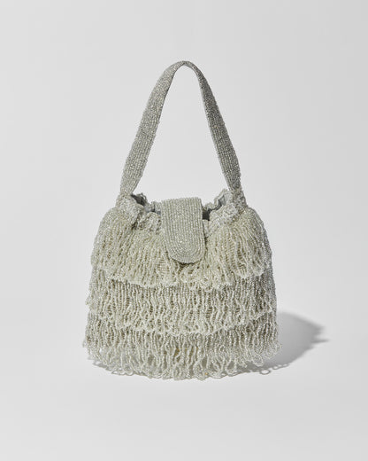 Silver beaded Tassel bag with layered fringe, top strap and beaded flap closure. Front view.