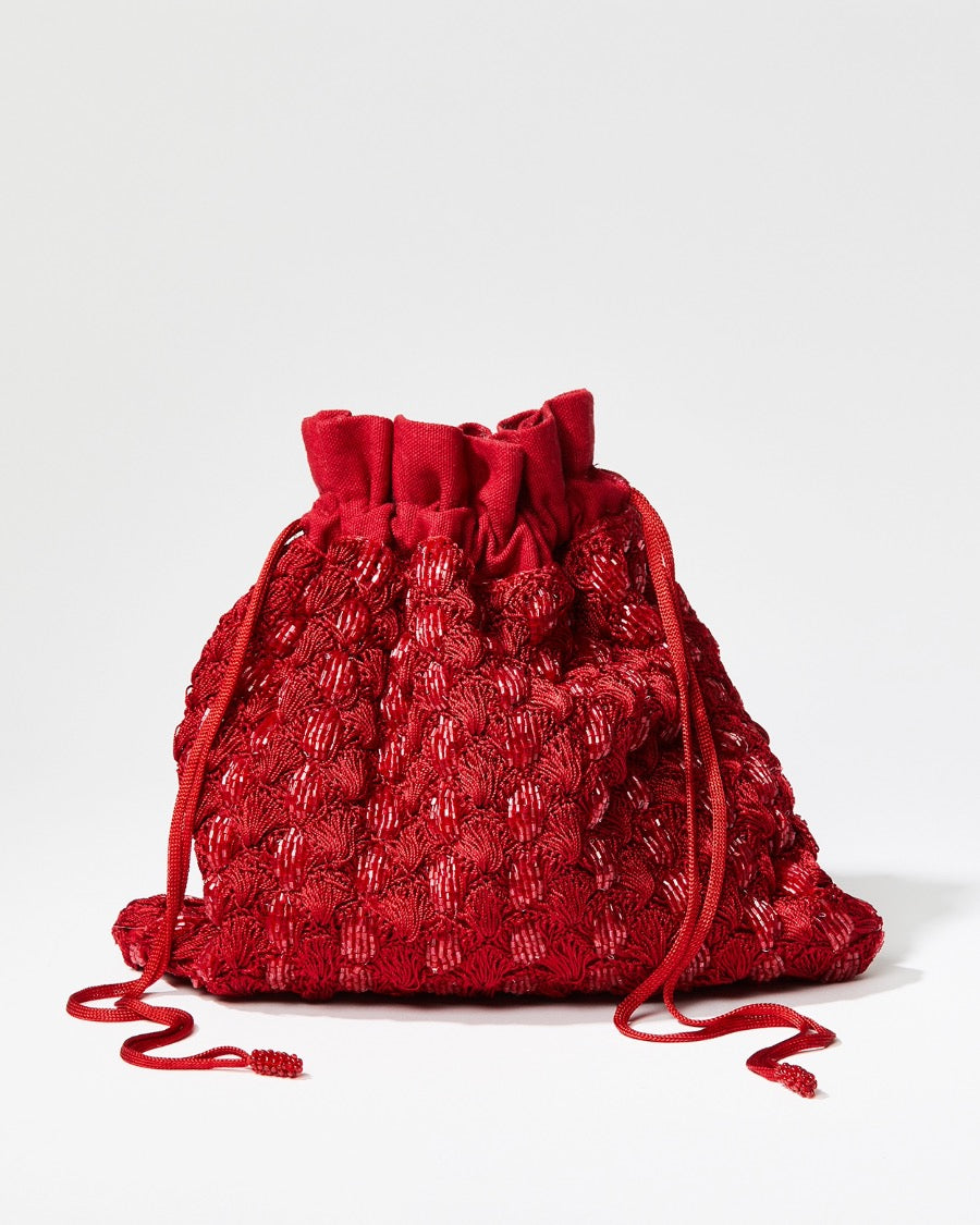 Front studio view of the As Always red beaded pouch featuring a hand-crocheted body with shimmering glass beads and beaded drawstrings.