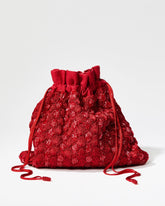 Front studio view of the As Always red beaded pouch featuring a hand-crocheted body with shimmering glass beads and beaded drawstrings.