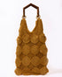 Full studio view of the Enveloped Tote in ochre, featuring handcrafted crochet circles and geometric bamboo top handles.