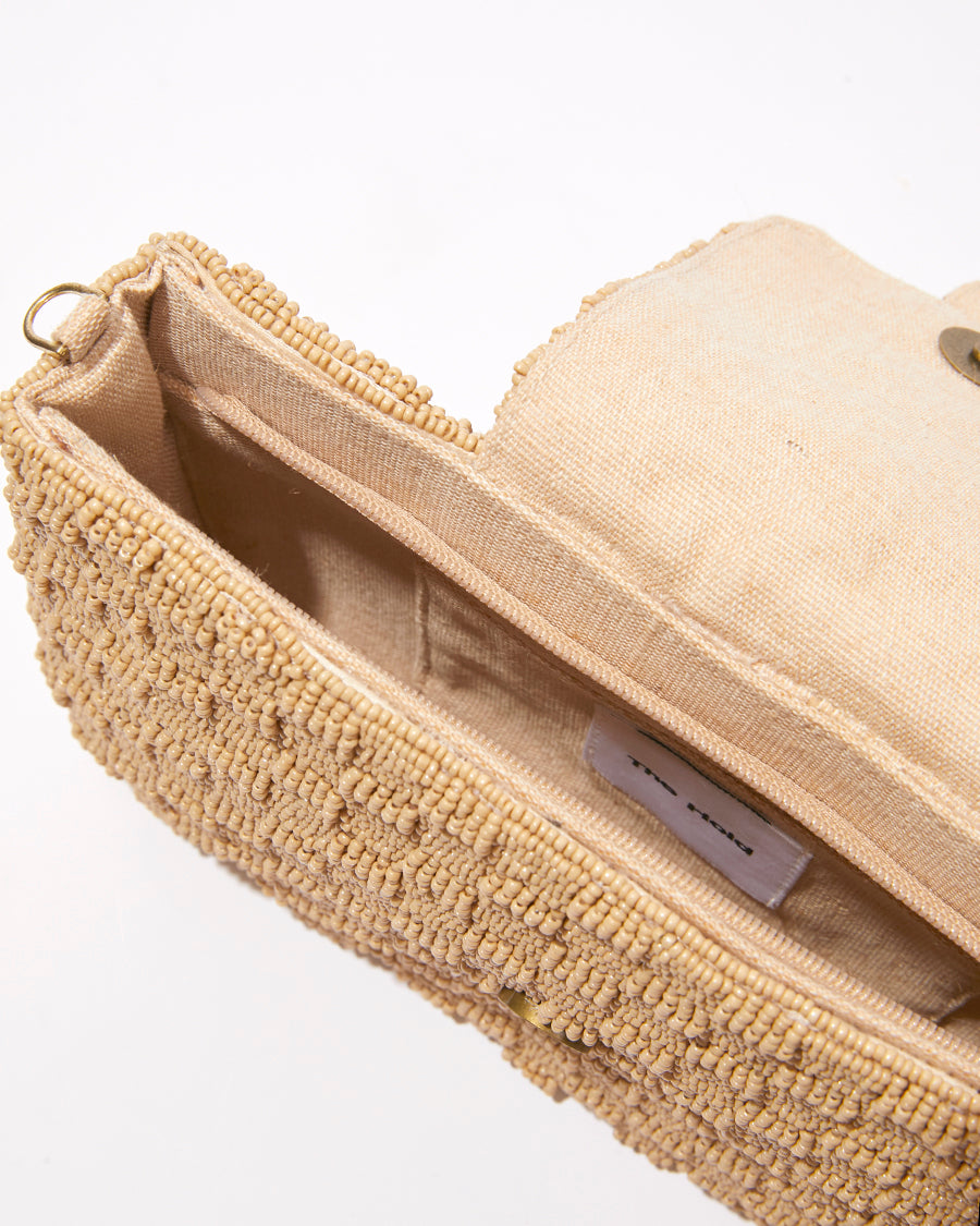 Open top view of the Familiar Way bag showing the natural jute lining and spacious interior designed to fit an iPhone Plus