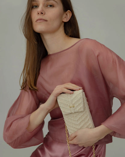 Model holding the Graceful Cascades mini bag in hand, demonstrating its versatility as a statement accessory for weddings and special occasions.