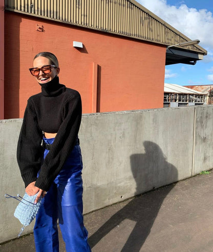 Customer wearing the His Eyes blue beaded bag crossbody with black jumper, street style photo