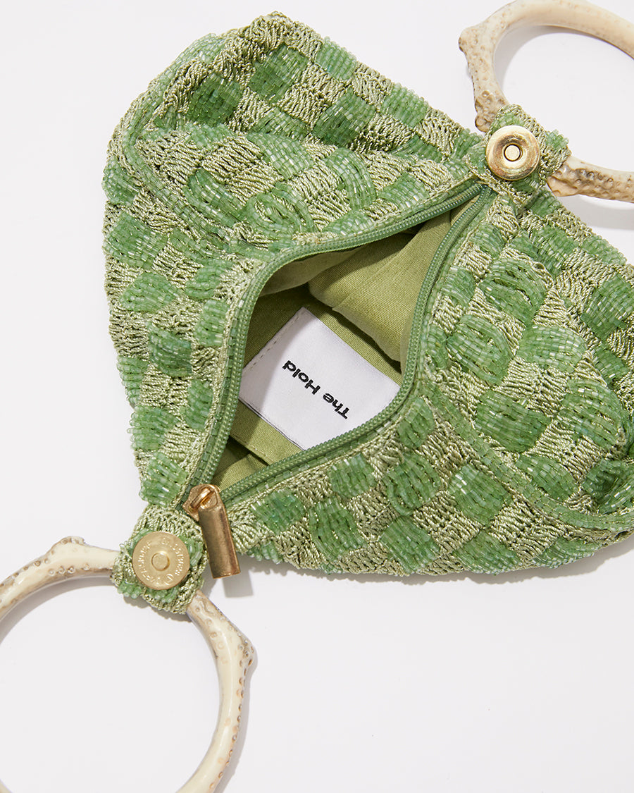 Intimate Exchange beaded bag in sage green showing opening and closure detail