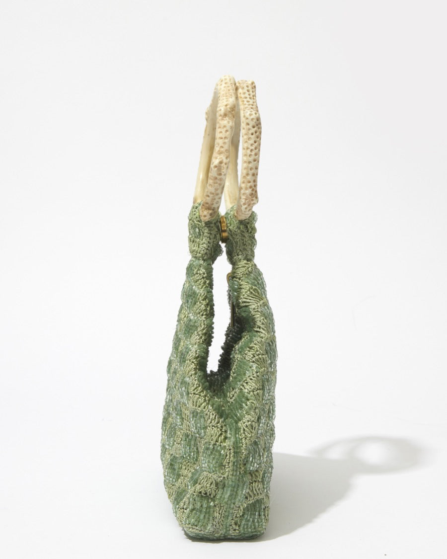 Intimate Exchange bag sage green, artisan-made beaded clutch style handbag, side view