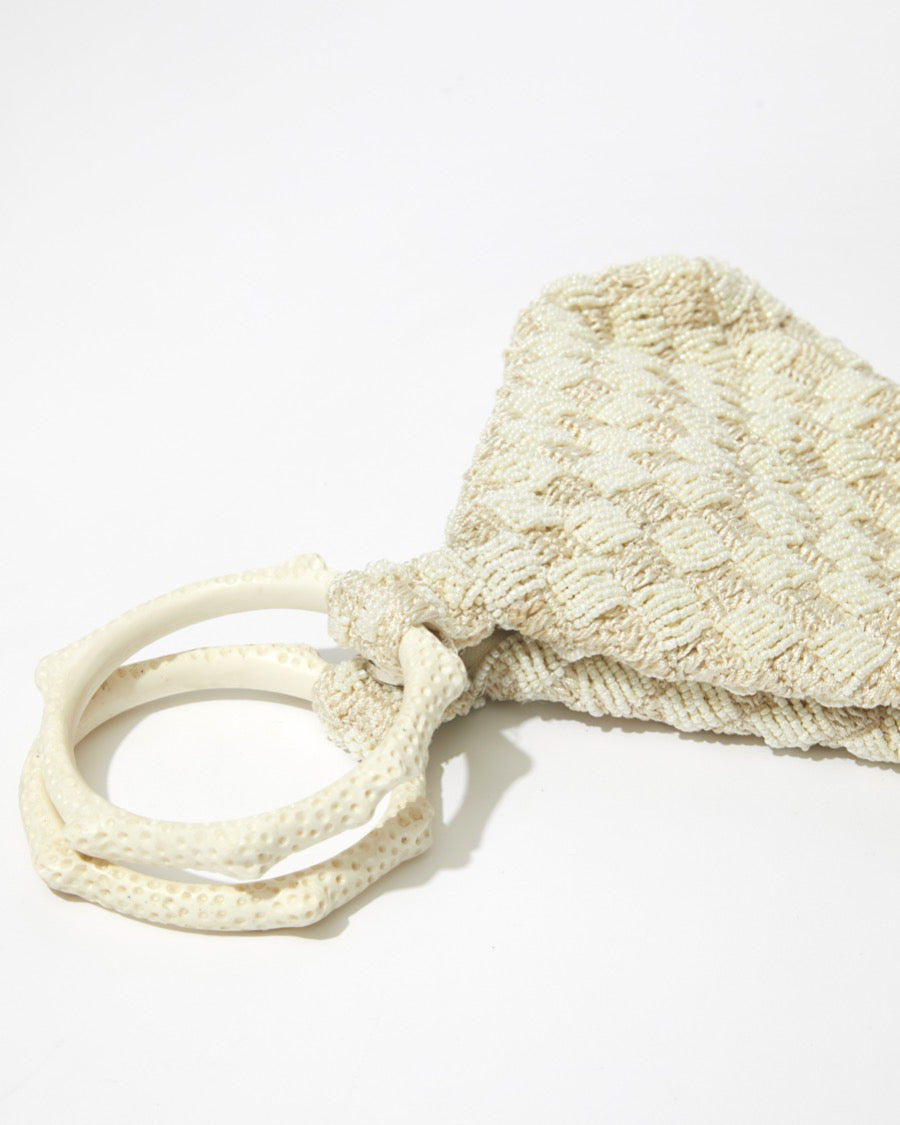Intimate Exchange ivory handbag, textured beaded detail, close-up. Bridal, wedding and event bag with pearl detail 