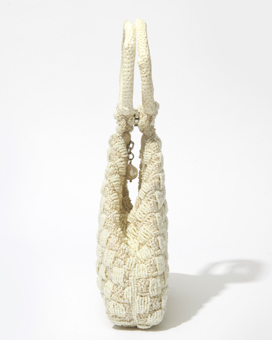 Intimate Exchange bag ivory with pearl, artisan-made beaded clutch style handbag, side view. Bridal, wedding and event bag.