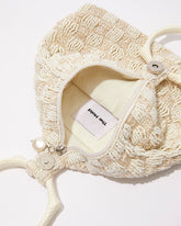 Intimate Exchange beaded bag in ivory showing opening and pearl closure detail. Bridal, wedding and event bag with pearl detail.