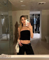 Intimate Exchange ivory handbag in hand, detail of shape and texture