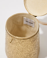 Open view of the Perception of Time bag showing the natural jute lining and internal space designed to fit an iPhone Plus.