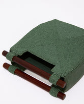 Side profile of the jade green Reach for Words bag showing its structured 5cm depth and the intricate hand-beaded texture