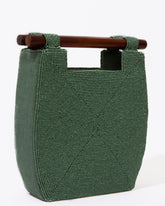Straight-on studio view of the jade green Reach for Words bag, highlighting the symmetrical minimalist design and wooden handles