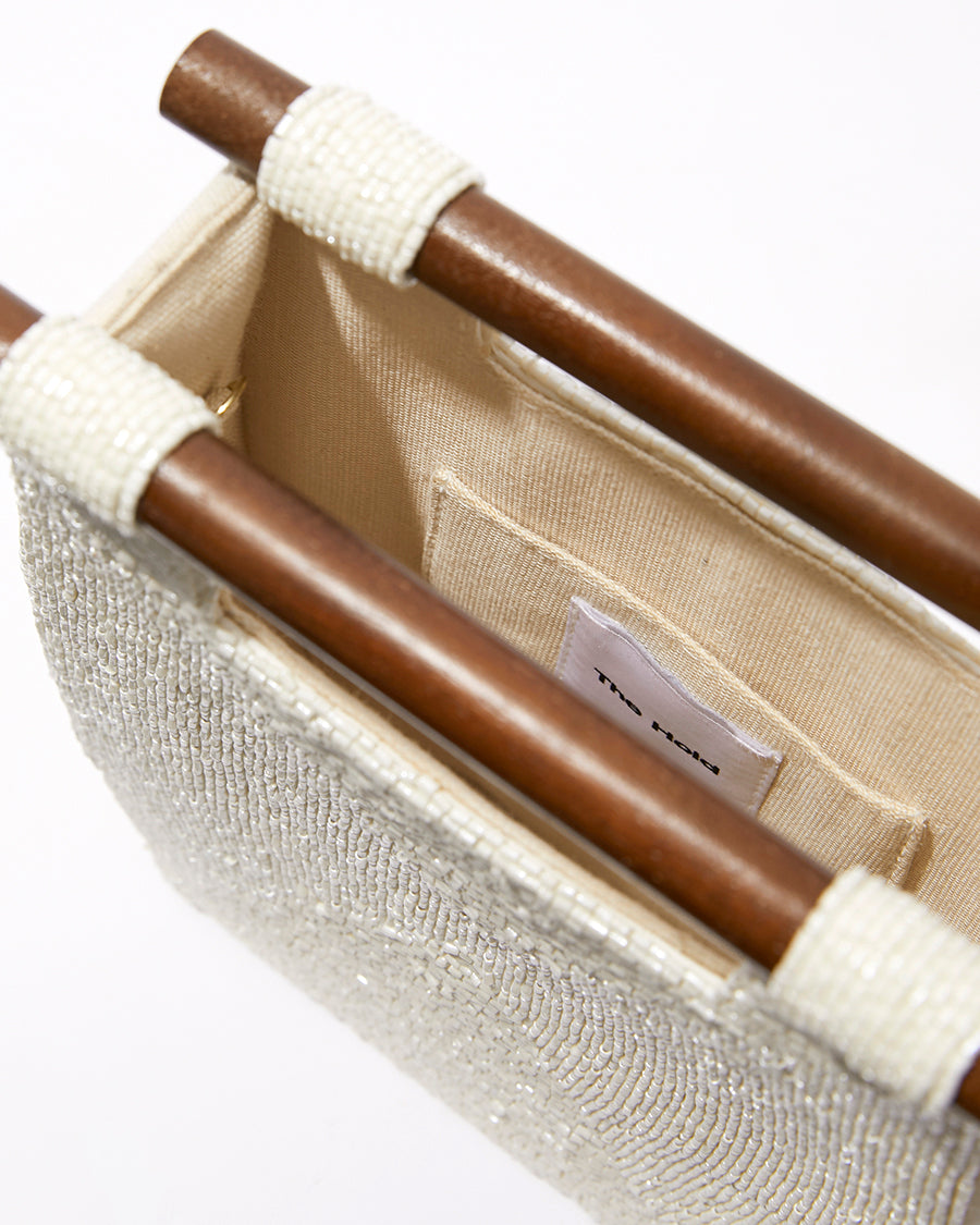 Detailed interior view of the Reach for Words bag showing the natural jute lining and internal storage pocket.