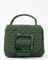 Straight-on studio shot of the jade green Uncovered Layers bag, showing the symmetrical resin buckle and beaded top handle.