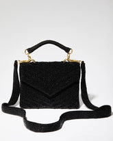 Black beaded chevron bag shown with its detachable 110cm beaded shoulder strap and gold-tone hardware for crossbody wear.