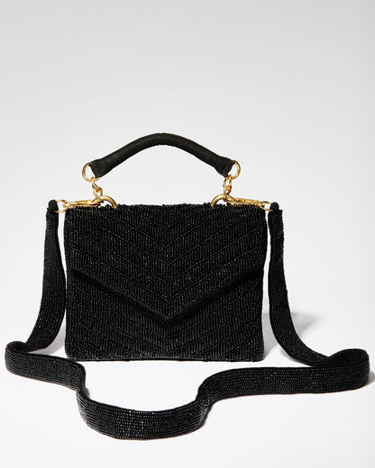 Black beaded chevron bag shown with its detachable 110cm beaded shoulder strap and gold-tone hardware for crossbody wear.