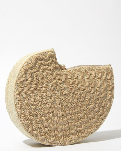 Side profile of the Beyond Us beaded clutch emphasising the 5cm depth and the clean, curved lines of the handcrafted beaded body.