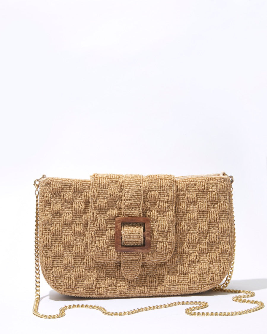 Front view of the Familiar Way bag with its detachable gold crossbody chain, showcasing its clean lines and versatile styling options.