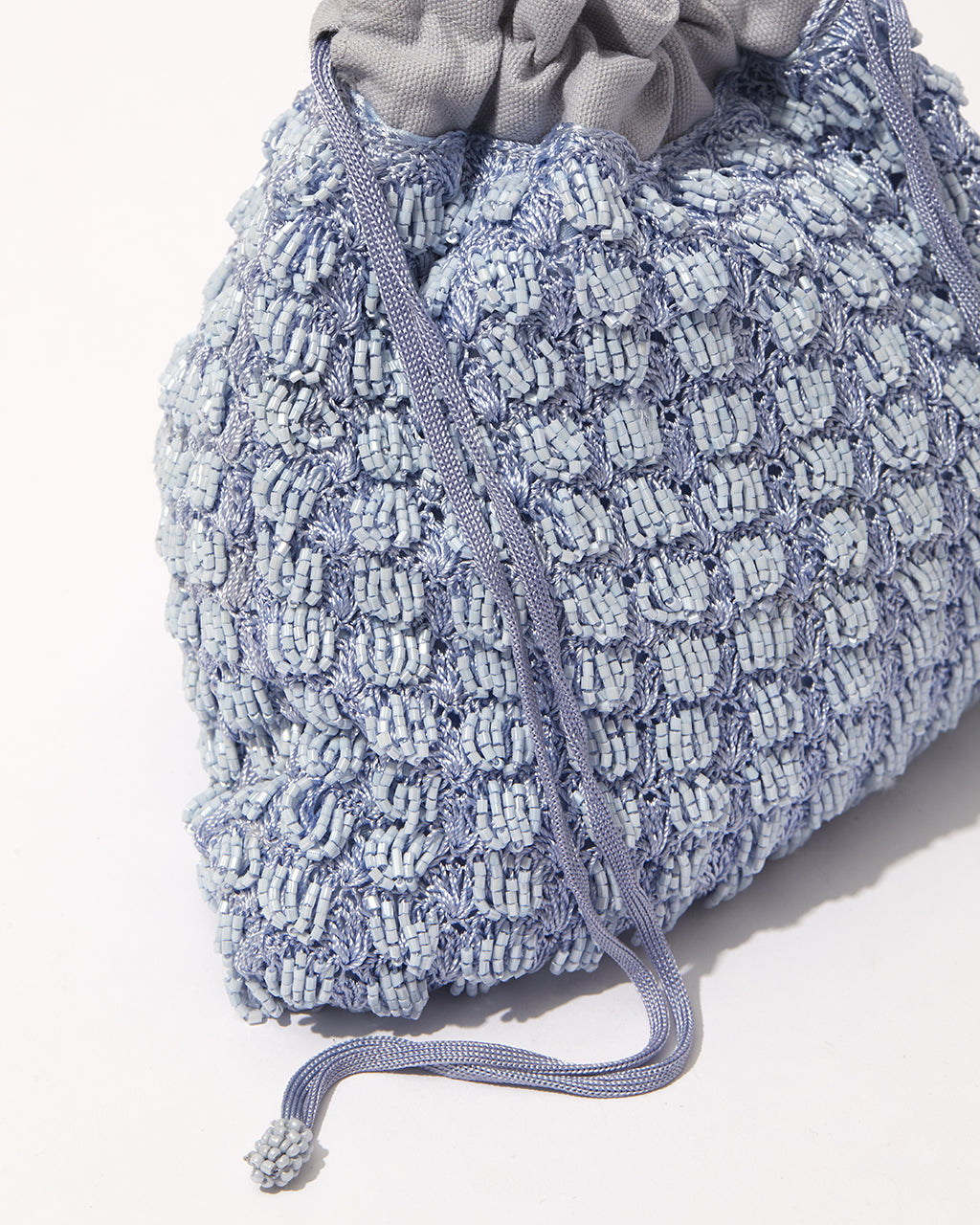 Close-up of His Eyes blue beaded bag showing beadwork texture