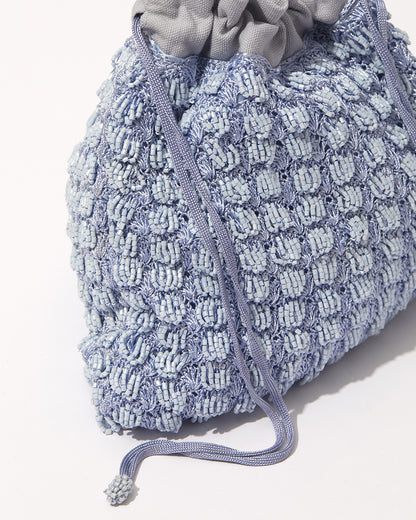 Close-up of His Eyes blue beaded bag showing beadwork texture