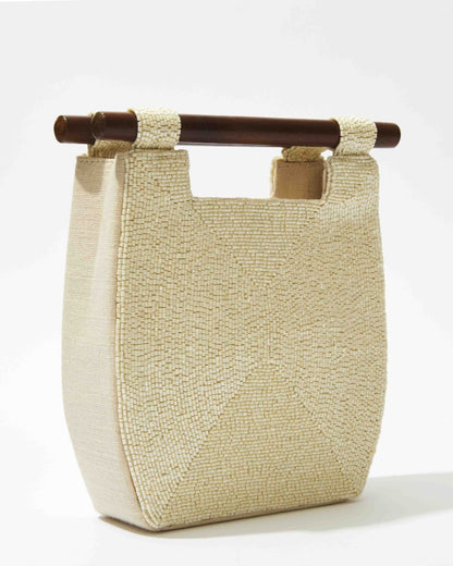 Side profile of the minimalist white beaded bag showcasing its structured 5cm depth and clean architectural lines.
