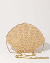 Front view of the Stand Still beaded clutch with its detachable gold chain strap, showcasing its transition from clutch to crossbody bag.